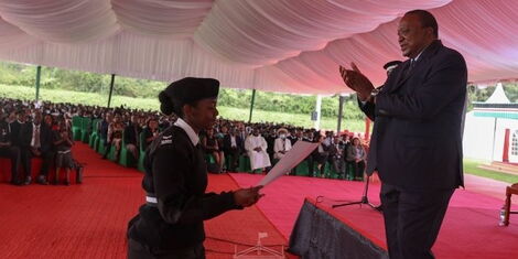 Predident Uhuru Kenyattaawards a St John Ambulance volunteer at the 92nd inspection parade on Sunday, May 29, 2022..jpg