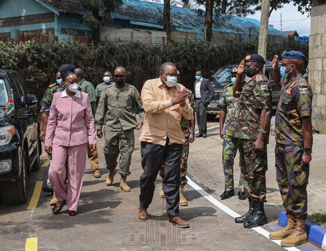 President Uhuru Kenyatta (in brown shirt) with Defence CS Monica Juma arrive at Kenya Meat Commission (KMC) Landhies Road deport on Monday, May 24, 2021.