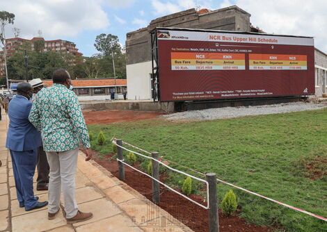 President Uhuru Kenyatta (in green shirt) and former Prime Minister Raila Odinga shown bus schedule at Green Park Terminus