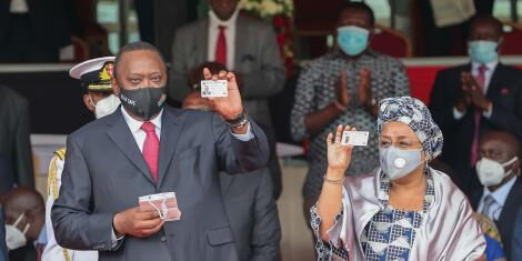 President Uhuru Kenyatta and First Lady Margaret display new Huduma Cards at Gusii Stadium on Tuesday, October 20, 2020.