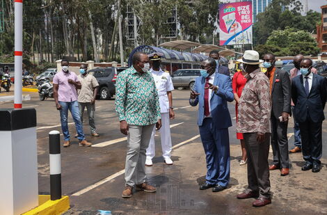 President Uhuru Kenyatta (in green shirt) and former Prime Minister Raila Odinga (in a brown shirt) at Green Park Terminus on Thursday, April 1, 2021.