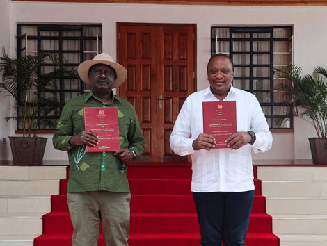 President Uhuru Kenyatta and former Prime Minister Raila Odinga display copies of the report after its presentation by the Building Bridges Initiative at Kisii State Lodge. October 21, 2020.