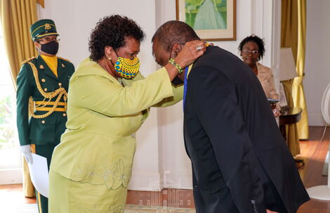 President Uhuru Kenyatta awarded by Governor of Barbados Dame Sandra Mason at Government House in Bridgetown.