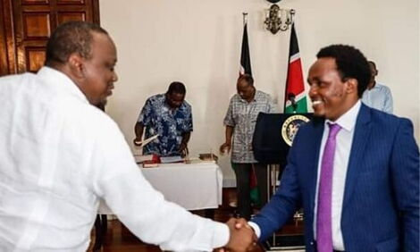 President Uhuru Kenyatta greets Zachary Kinuthia during his appointment as Chief Administrative Secretary (CAS) in the Ministry of Education on January 14, 2020. 