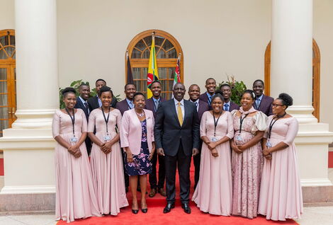 President William Ruto (fourth from right), his wife Rachel (third from right) and Zabron singers in State House.