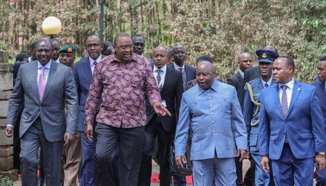 President William Ruto (left), his predecessor Uhuru Kenyatta entertain other leaders in Nairobi on Monday, November 28, 2022.