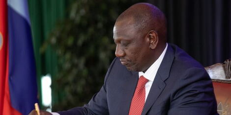 President William Ruto signs a document during the swearing in ceremony of CSs on October 27, 2022..jpg