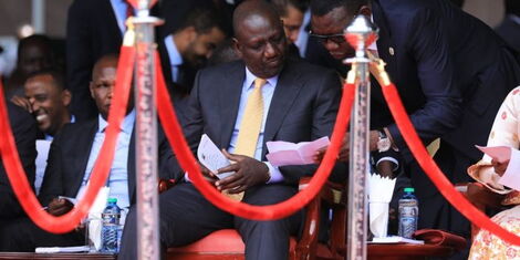 President-elect William Ruto looks at the swearing in program alonside his Chief of Staff Davis Chirchir at the Ksarani Stadium on Tuesday, September 13, 2022.