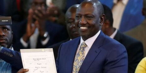 President-elect William Ruto poses with his election certificate at the Bomas of Kenya on Monday, August 15, 2022..jpg