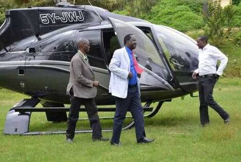 Former Prime Minister Raila Odinga alighting from a chopper in November 2018