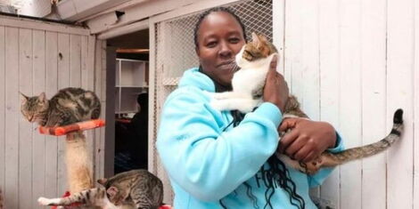 Rachel Kabue with some of her cats at her Sanctuary