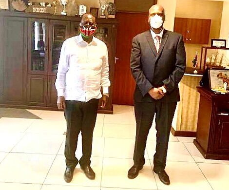 Former Prime Minister Raila Odinga poses with Nairobi Metropolitan Services (NMS) Director General Maj. Gen Mohammed Badi at his Capitol Hill office in Nairobi on March 15, 2020