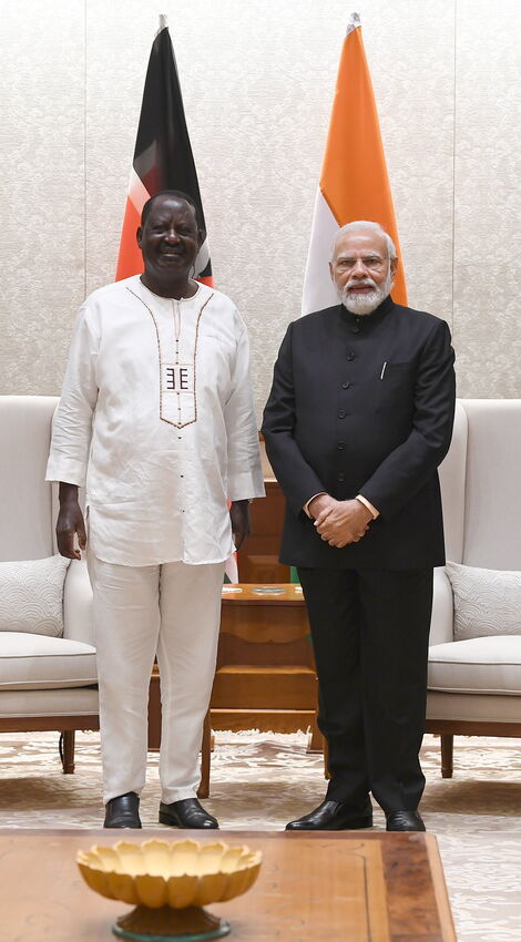 Kenya's former Prime Minister Raila Odinga (left) and India’s Prime Minister Narendra Modi (right) in India on February 13, 2022