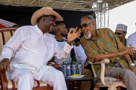 Raila Odinga and BBI taskforce head Yusuf Haji enjoy a hearty moment during the BBI Garissa rally on February 23, 2020.