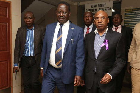 ODM leader Raila Odinga (left) and businessman Jimi Wanjigi leave the court.