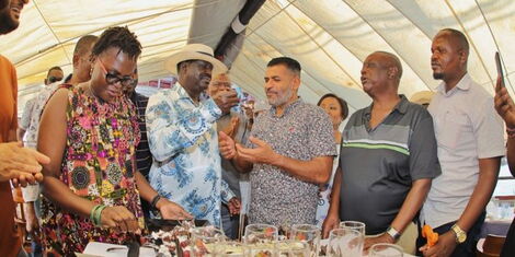 Former Prime Minister Raila Odinga shares his birthday cake with Mombasa Governor Abdulswamad Shariff Nassir in a dhow on Sunday, January 7, 2022