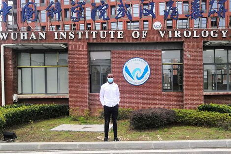 Kenyan microbiology research fellow Raphael Ohuru Nyaruaba at the main entrance of the Wuhan Institute of Virology.