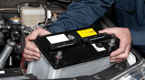 File photo of a car owner replacing a car battery