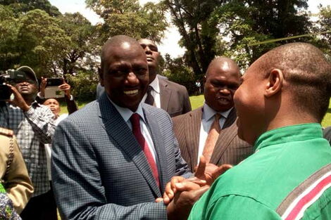 Deputy President William Ruto shakes hands with Nominated MP David Ole Sankok at an event in Kisii County on October 6, 2016