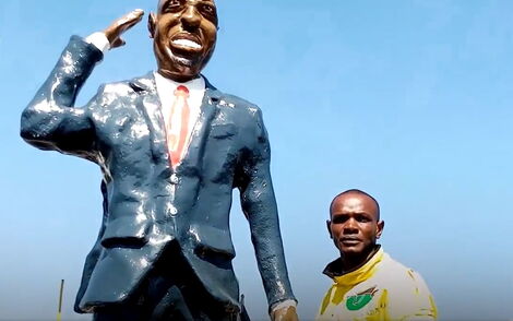 Silas Wanjeru poses with Deputy President William Ruto's sculptor on Saturday, May 21, 2022 