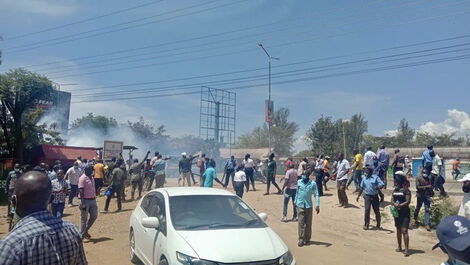 Police lob teargas to disperse a rowdy crowd in Kondele, Kisumu County during DP William Ruto tour on November 10, 2021.