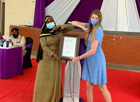 British High Commissioner Jane Mariott presenting the Commonwealth Points of Light award to Saida Hussein on behalf of Queen Elizabeth on March 8, 2021