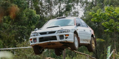 A car goes airborne during a past safari rally competition