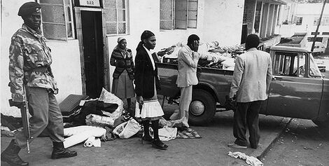 Security officers restore order amid widespread looting in Nairobi city during the 1982 coup attempt.