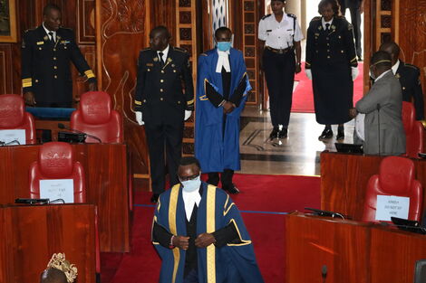 Senate Speaker Ken Lusaka makes his way to the chambers on Tuesday, March 31, 2020 donning protective gear