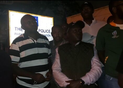 Senator Samson Cherargei with Dennis Itumbi's family at Parklands Police station on Thursday, December 23, 2021.