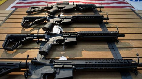 Several guns laid on a table