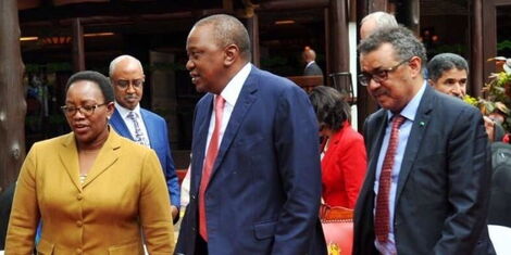 Former Water CS Sicily Kariuki (Left) together with President Uhuru Kenyatta (Center) at a past event.