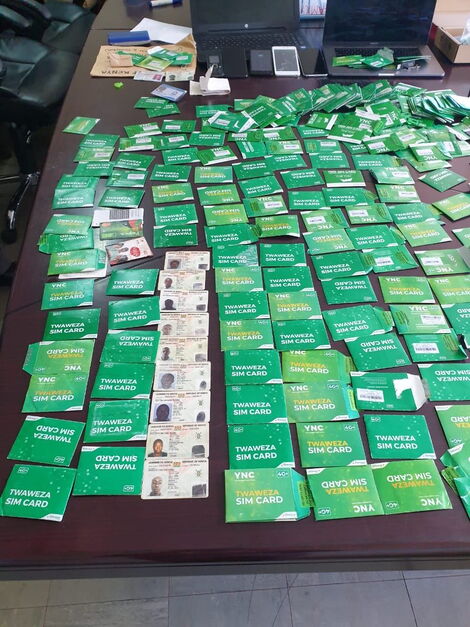 Some of the electronics and sim cards seized during a raid in Juja on Thursday, May 14, 2020.