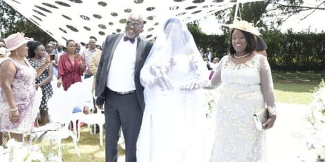 Soy MP Caleb Kositany and his wife walk their daughter Stacey Kositany down the aisleduring her white wedding on Saturday, March 19. .jpg