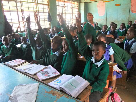 Students during a lesson at Kibra Primary School. Dr Stella Bosire studied at the school before she was expelled in Class Five.