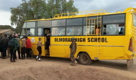 Students from Ol Moran Secondary School arrive home safely after military escort.