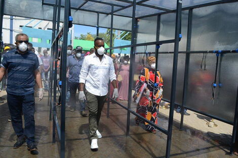 Suleiman Shabhal and Hassan Joho inspecting the newly installed public spray booth at the Likoni Crossing Channel in Mombasa.