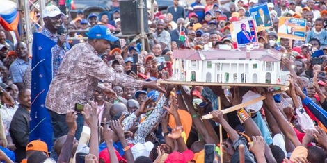 Suna West MP Junet Mohammed receives a model of the State House during a rally at the Ole Ntimama Stadium on Sunday, May 22, 2022.