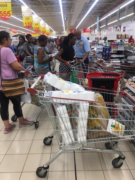 A photo of carts full of supplies as people shop at a supermarket in Nairobi on Friday, March 13, 2020.