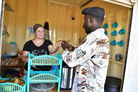 Sylvia Bichanga at her shop in Kisumu where she sells American street food. (Undated)