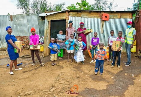The family of 7 from Kahawa West pose for a photo after Akothee's visit on May 5, 2020.