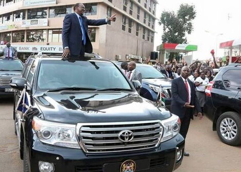 President Uhuru Kenyatta pictured atop one of his Toyota Landcruiser 200 series.
