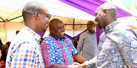 Trade CS Nominee (far right) exchanges pleasantries with former Baringo Governor Alex Tolgos during a funeral service in Elgeyo Marakwet County on Saturday, October 1, 2022