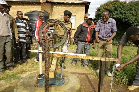 Trans Nzoia East Sub-County AP Commander Osman Galgalo pumps water from one of the boreholes he drilled.
