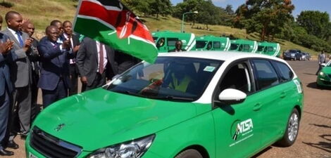 Transport CS James Macharia flags off an NTSA branded car