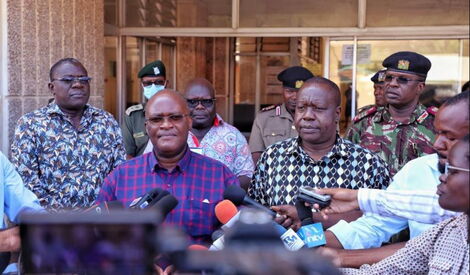 Transport Cabinet Secretary James Macharia (second left) and Interior CS Fred Matiang'i (third from left) address the press in Mombasa.