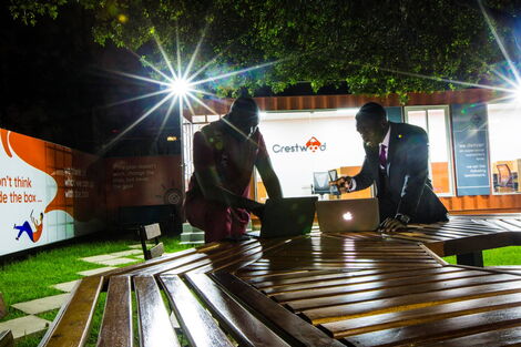 Trevor Ombija and David Osiany during a brainstorming session at Crestwood officers in Kilimani