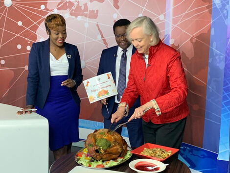 US ambassador to Kenya Meg Whitman carving a turkey at KTN News studios on Thursday, November 24, 2022