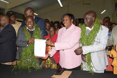 Uasin Gishu County governor-elect Jonathan Bii second left recieving the election certificate on August 12, 2022