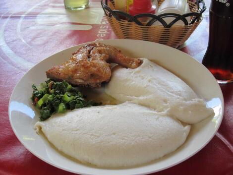 A plate of chicken ugali